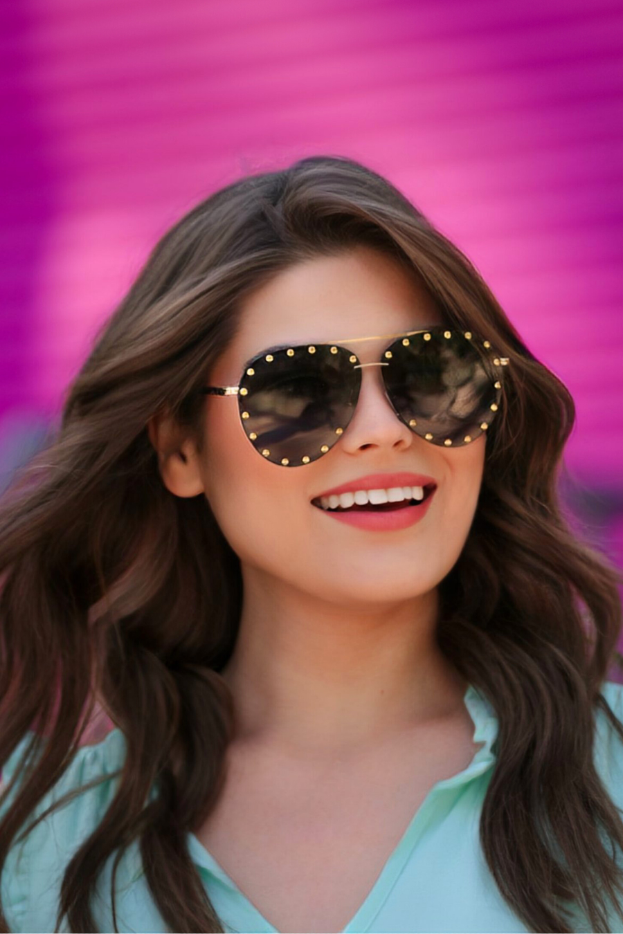 a women wearing aviator sunglasses