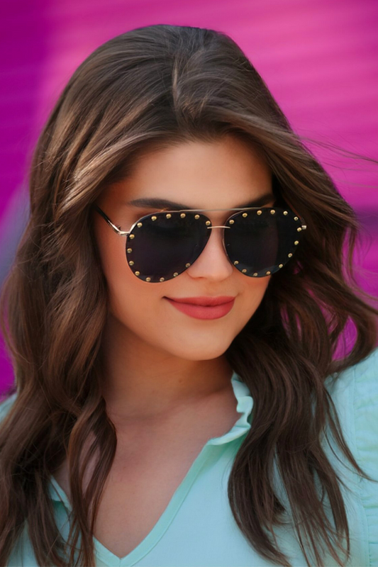 a woman wearing aviator sunglasses